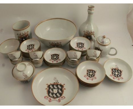 An 18th century Chinese armorial service, decorated with a family crest of owls, owls in a shield and the motto "EX CALICINE 