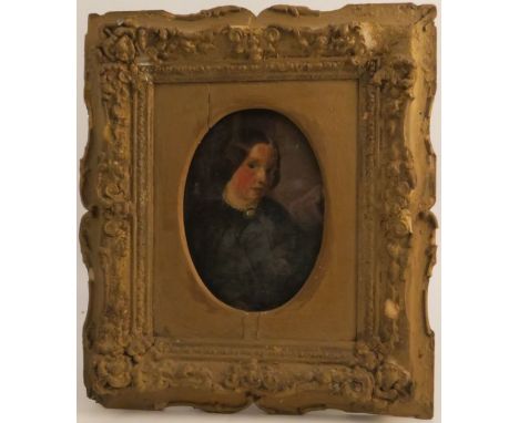 A 19th century oil on artist board, oval portrait of a woman dressed in black, maximum diameter 6.5ins