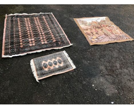 A tapestry, together with two rugs