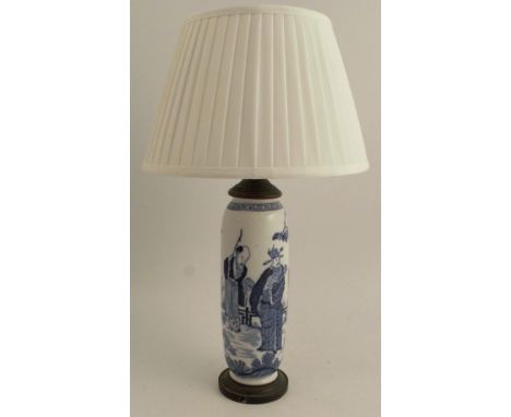 An early 20th century Oriental blue and white porcelain table lamp, the porcelain body decorated with figures, with gilt meta