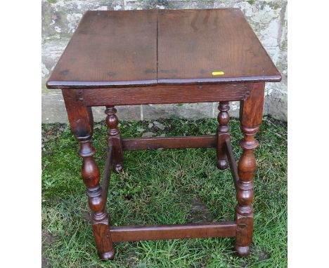 A late 17th century square oak tavern, or lamp, table, with baluster turned legs united by stretchers, width 20.5ins