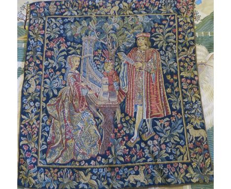 A Liberty style tapestry wall hanging, of three figures in medieval dress playing musical instruments, with leaves etc, purch