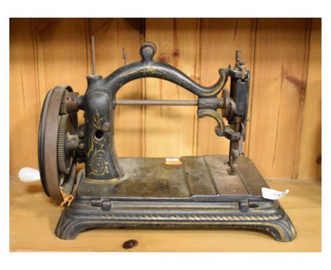 Wing &amp; Co vintage C-frame sewing machine having hinged base, 27cm high  
