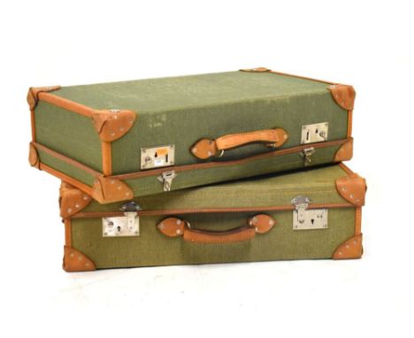 Good quality vintage canvas and leather bound suitcase, the locks stamped Hodges of Wolverhampton, 67cm wide  