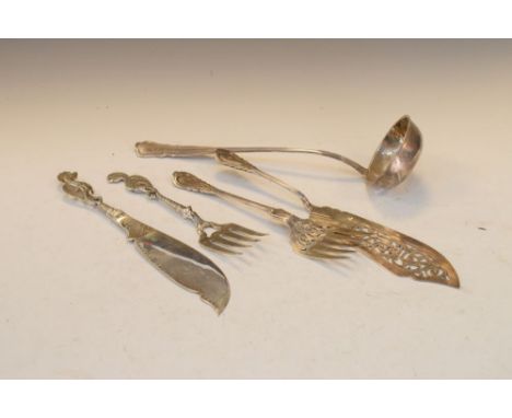 Pair of Eastern white metal fish servers with seahorse terminals, Arabic stamp to base of knife blade, 29cm long, together wi