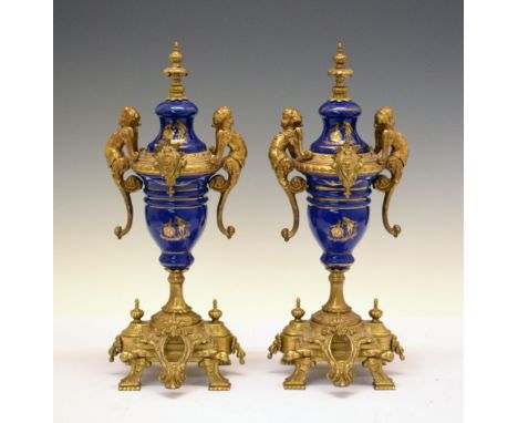 Pair of Continental gilt metal and ceramic urns, 35.5cm high  
