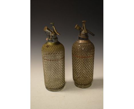 Two vintage wirework soda syphons  