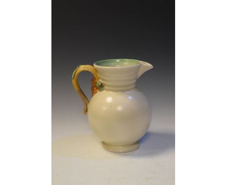 Large Clarice Cliff water jug having foliate handle, shape 895, 23cm high, moulded marks to base  