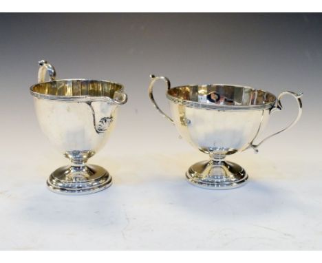 George V silver milk jug and two handled pedestal sugar basin, Birmingham 1932, 5.8toz approx (2)  