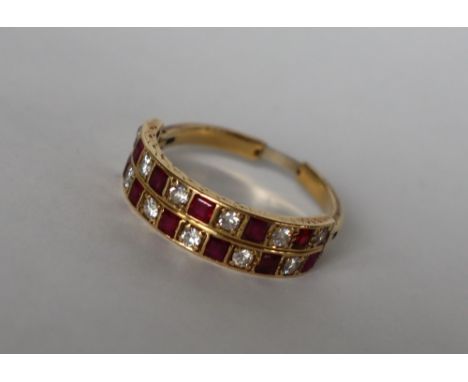A ruby and diamond two line half eternity ring set with twelve princess cut rubies and twelve round old cut diamonds to a hin