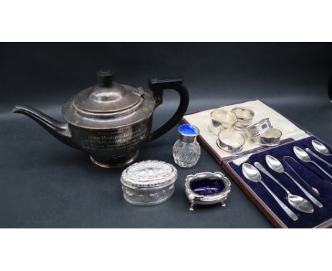 A George VI silver teapot with a domed cover and tapering body on a spreading foot, Birmingham, 1938 together with cased silv