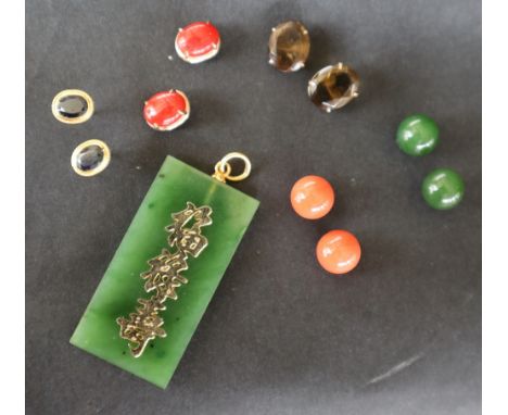 A Jade pendant of mottled green colour and rectangular form, yellow metal set together with a pair of jade ball earrings and 