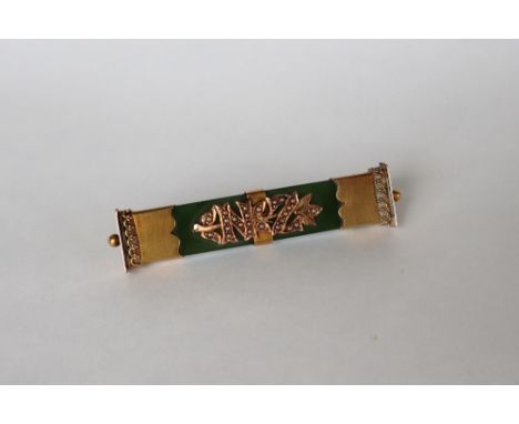 A 15ct gold Nephrite Jade New Zealand bar brooch, with gold terminals, and seed pearl set NZ initials to the centre, 53mm lon
