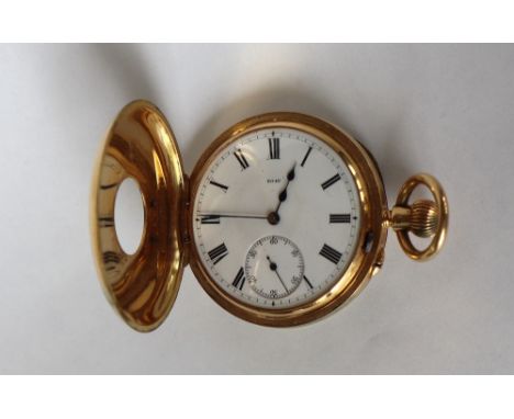 An 18ct yellow gold keyless wound half hunter pocket watch, the enamel dial with Roman numerals and a seconds subsidiary dial
