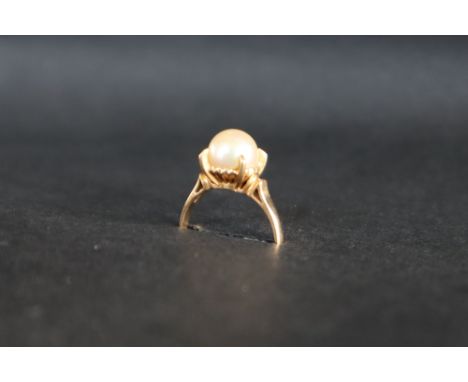 An 18ct yellow gold pearl set ring, the pear approximately 8mm in diameter, size N, approximately 2.8 grams