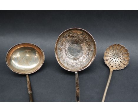 A Victorian silver apostle topped sifter spoon, marks indistinct together with a white metal ladle set with a Queen Anne shil