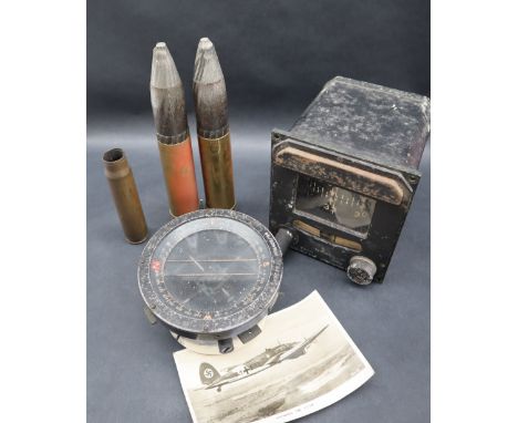 A Siemens Gyro compass / slip indicator together with a type P8 aircraft magnetic compass and 20mm canon shell casings all sa