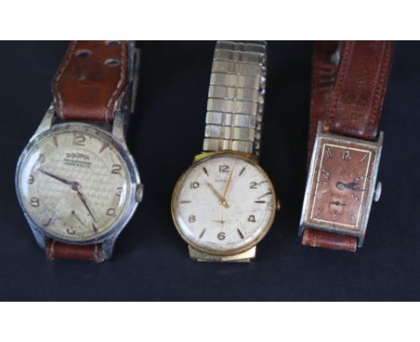 A gentleman's Dogma wristwatch with a textured dial, Arabic numerals and batons with a seconds subsidiary dial, 38mm diameter