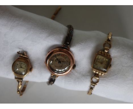 A lady's 9ct yellow gold Rotary wristwatch with a square dial, on an expanding bracelet strap together with another lady's 9c