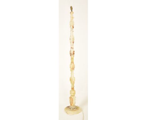 A retro 20th century 1970s alabaster lamp standard. The lamp light having a shaped moulded steam with onyx style detailing th
