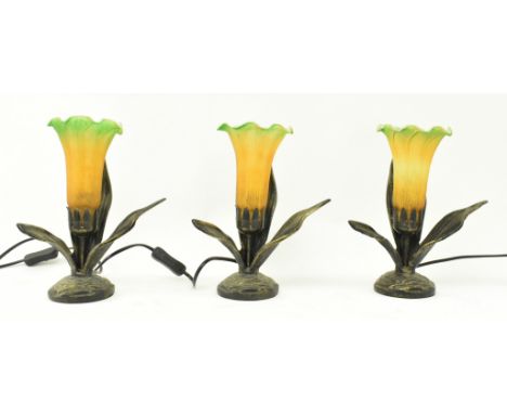 A set of three Art Deco inspired late 20th century coloured glass & metal flower shaped desk table lamps. Each lamp having a 