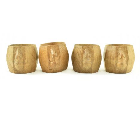 Workshop of Robert ' Mouseman ' Thompson of Kilburn - A set of four of 20th century oak hand carved faceted napkin rings. Eac