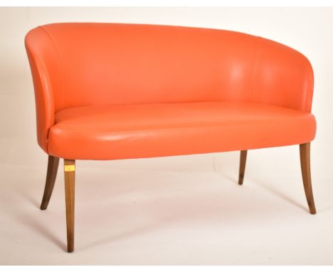 Manner of Ole Wanscher - A contemporary designer Danish influenced two seater sofa settee. The sofa having a curved backrest 