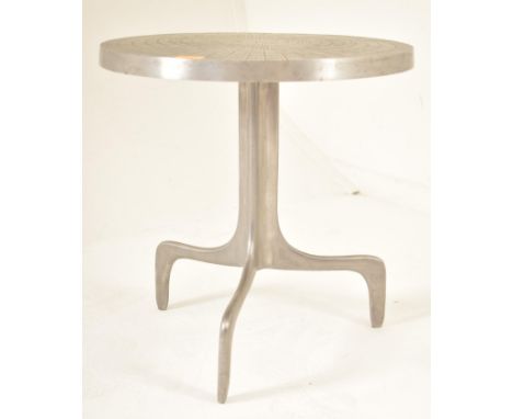 A contemporary high end design cast aluminium coffee table / occasional table. The table having a circular top with natural w