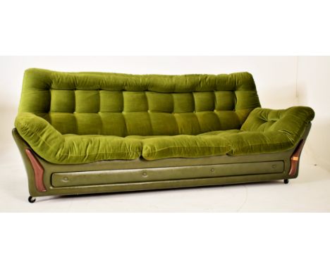 Dykes Furniture - A retro 20th century Scottish designer three seater sofa settee. The sofa with green velvet and leatherette