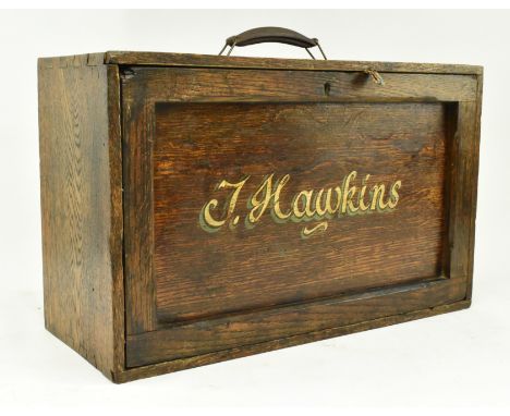 A vintage 20th century oak cased engineers / workman's tool chest. The chest having a leather handle to top over a full lengt