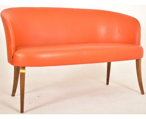 Manner of Ole Wanscher - A contemporary designer Danish influenced two seater sofa settee. The sofa having a curved backrest 