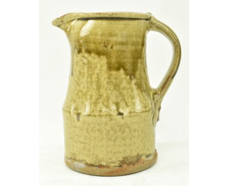 Jim Malone (b. 1946) - A studio art pottery stoneware slip glaze jug vase in earthy tone. Stamped JM to base with A mark for 