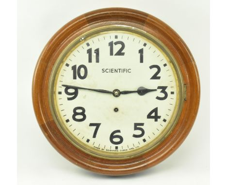 Scientific Clock Manufacturing Company - An early 20th century circa 1920s oak framed railways station wall clock. The clock 