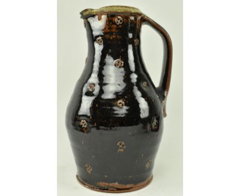 Phil Rogers (1951-2020) - A studio art pottery stoneware glazed pouring jug by Phil Rogers. The jug having a single handle to