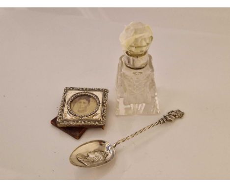 Tiny photo frame and mounted sent bottle and a commemorative spoon 1901