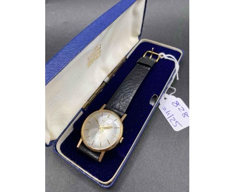 A good gents wrist watch by GARRARD 9ct with leather strap W/O in original box