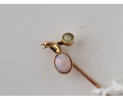 A vintage fiery opal and peridot stick pin with screw top 15ct gold