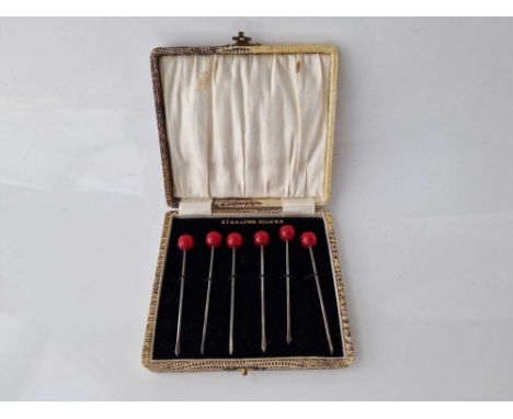 Boxed set of sterling silver cocktail sticks with cherry ends