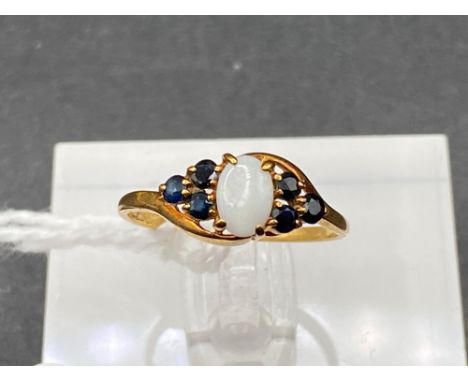 A sapphire and opal ring 9ct size L