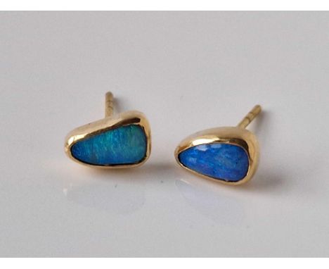 A pair of opal ear studs 18ct gold