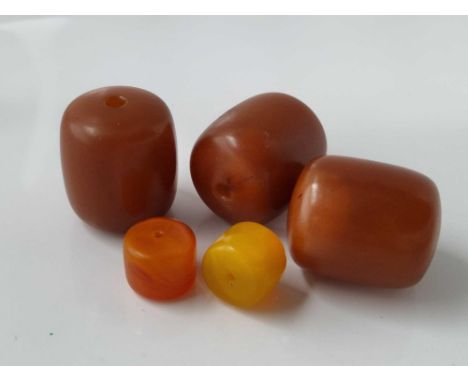 Three Large Amber Beads &amp; Two Smaller Examples