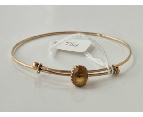 A gold expanding stone set bangle 4.4 gms 60mm diameter