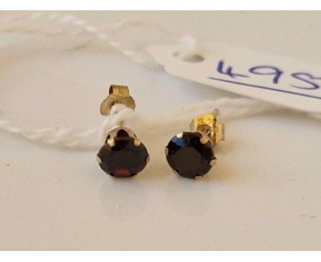 A pair of garnet stud earrings 9ct