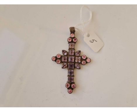 A silver amethyst and pink stone cross pendant