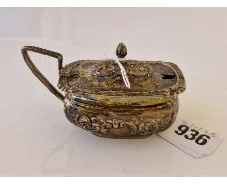 Oval mustard pot with embossed body. Birmingham 1899 By I W 59gms