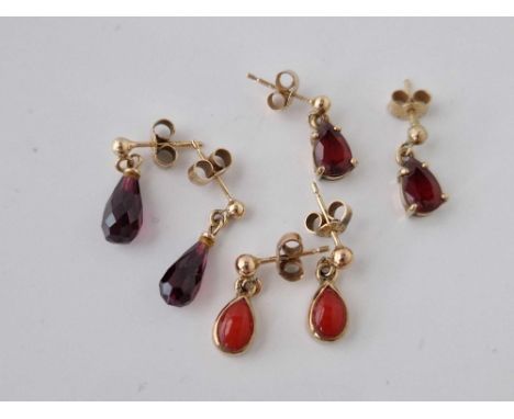 Three pairs of 9ct drop earrings set with garnets and coral