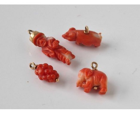 Four gold mounted coral charms