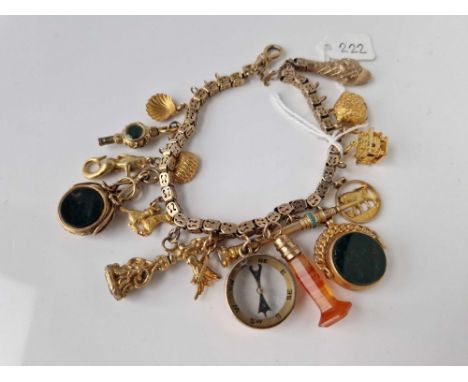 A GOOD GOLD CHARM BRACELET WITH NUMEROUS CHARMS 9CT 7 INCH 64.6 GMS