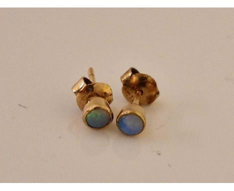 A pair of opal ear studs 9ct