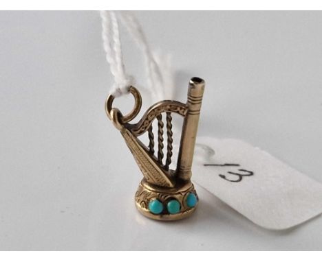 A antique harp watch key fob with turquoise gold case